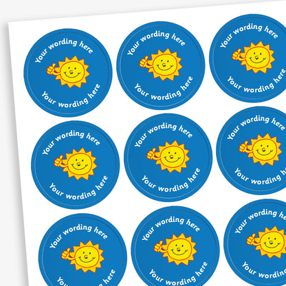 A sheet of circular, blue reward stickers featuring a smiling sun with a thumbs up. Placeholder text above and below 'Your wording here' indicate customisation options.