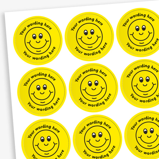 A sheet of circular, yellow reward stickers featuring a black oulined smiling face in the centre. Placeholder text above and below 'Your wording here' indicate customisation options.