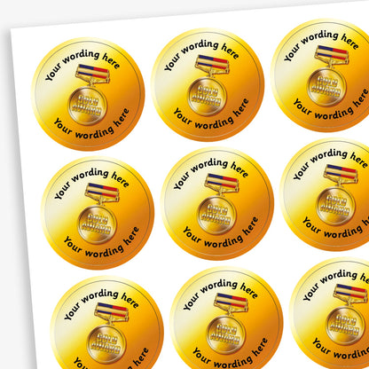A sheet of metallic gold stickers.  The centre has an image of a gold award medal with placeholder text  'Your Wording Here' representing customisation options above and below the image.
