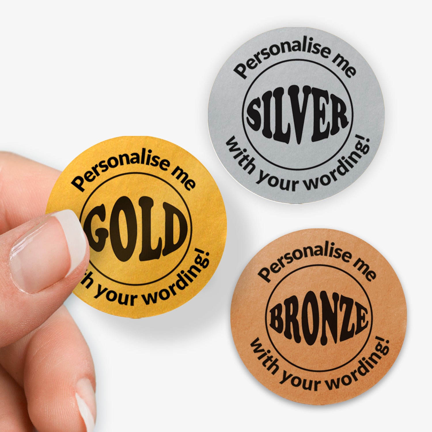 Three round stickers in gold, silver, and bronze with text 'Personalise me' and 'Gold', 'Silver', 'Bronze' respectively.