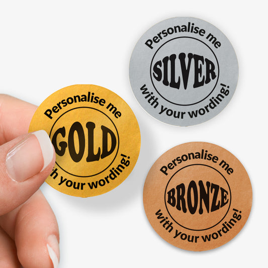 Three round stickers in gold, silver, and bronze with text 'Personalise me' and 'Gold', 'Silver', 'Bronze' respectively.