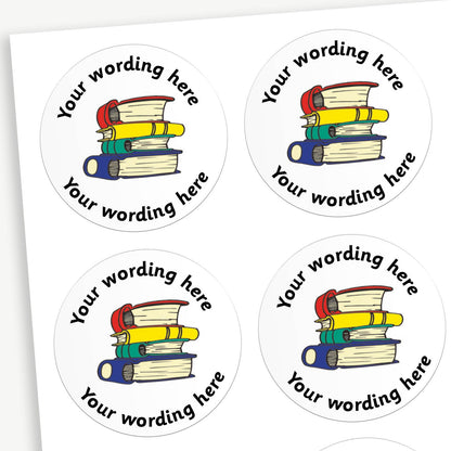 Sheet of round white stickers featuring a colourful stack of books in the centre. Each sticker has placeholder text reading 'Your wording here' curved above and below the illustration. 