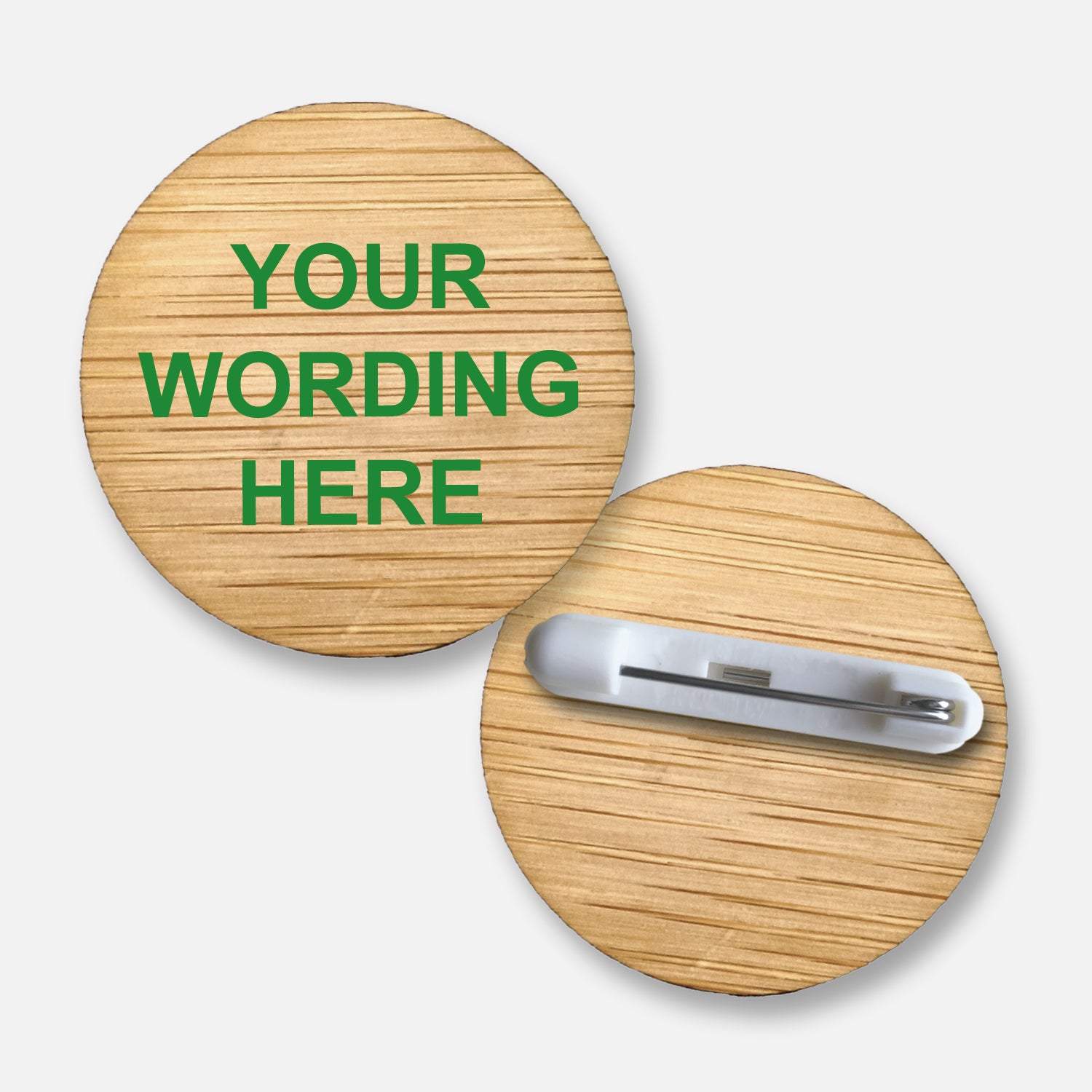 A 38mm circular badge crafted from natural bamboo, featuring the placeholder text 'Your Wording Here' in green capital letters on the front, with a pin fastening on the reverse side.
