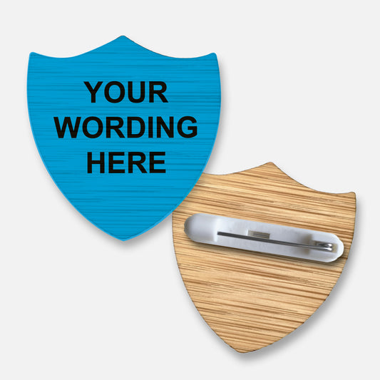 Eco-friendly personalised shield-shaped badge crafted from sustainable bamboo, featuring a customisable space for text or names, ideal for pupil awards, achievements, or eco-conscious recognition in educational settings.
