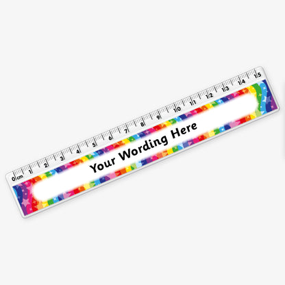 15cm plastic ruler with a rainbow coloured swirling background with stars with space in the centre for custom wording in bold text.