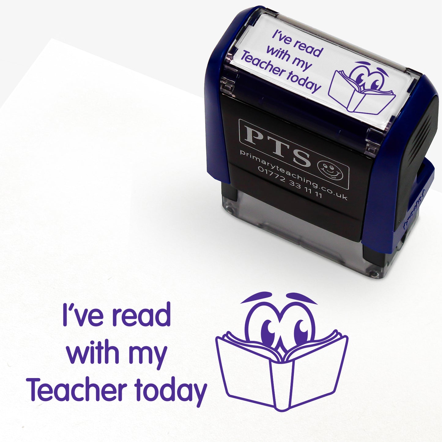 Rectangular self-inking stamper measuring 38mm by 15mm, featuring the phrase 'I've read with my Teacher today' in purple text above an illustration of a smiling open book with eyes; designed for marking pupils' reading records and homework diaries.