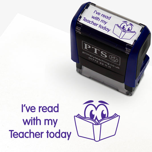 Rectangular self-inking stamper measuring 38mm by 15mm, featuring the phrase 'I've read with my Teacher today' in purple text above an illustration of a smiling open book with eyes; designed for marking pupils' reading records and homework diaries.