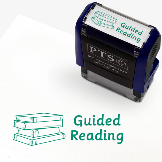 Rectangular self-inking stamper measuring 38mm by 15mm, featuring the phrase 'Guided Reading' in green text alongside an illustration of a stack of three books; designed for marking pupils' reading records and homework diaries.