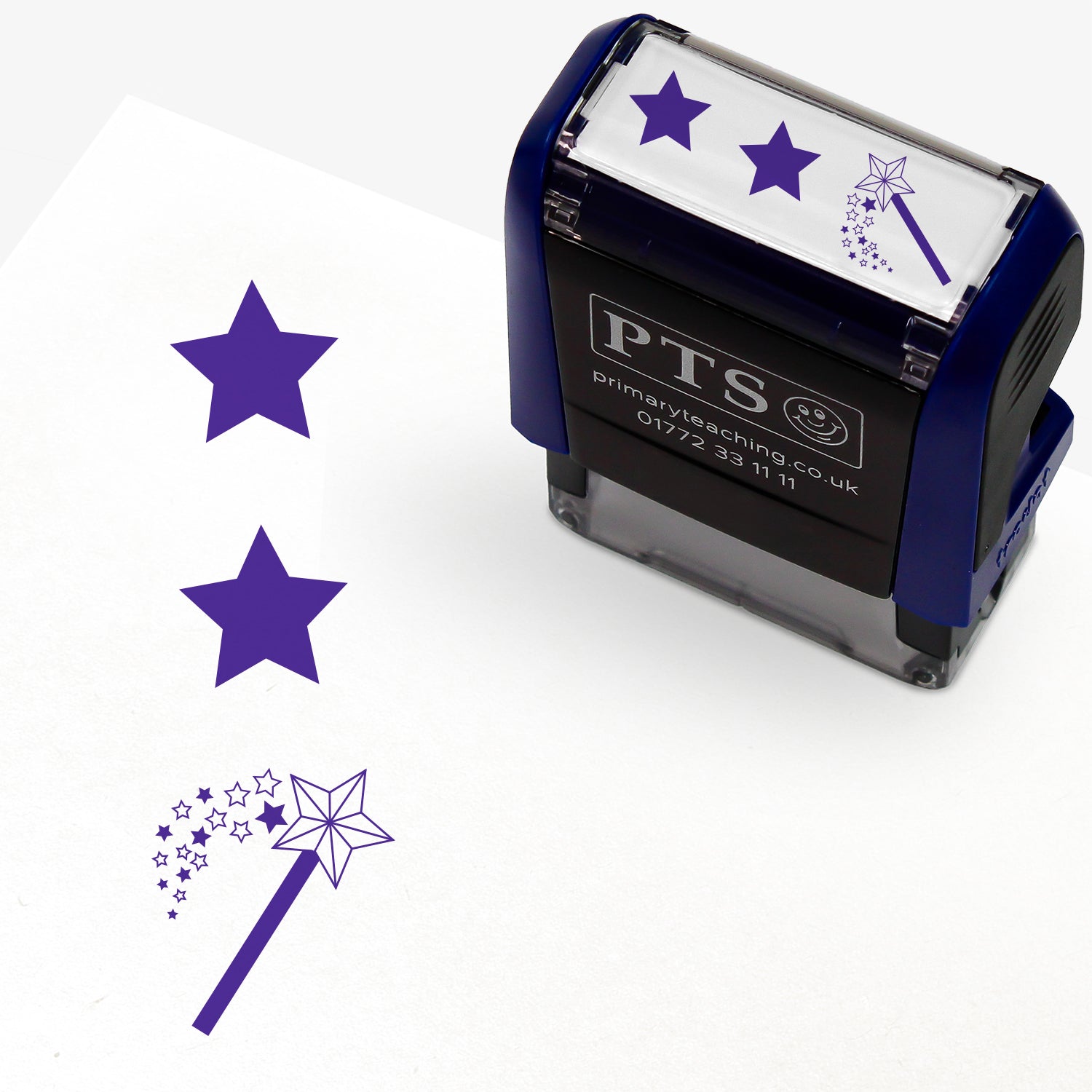 A rectangular pre-inked teacher stamper measuring 38mm x 15mm, featuring a purple vertical impression: a star at the top, a star in the middle and a wand with a shower of stars underneath.
