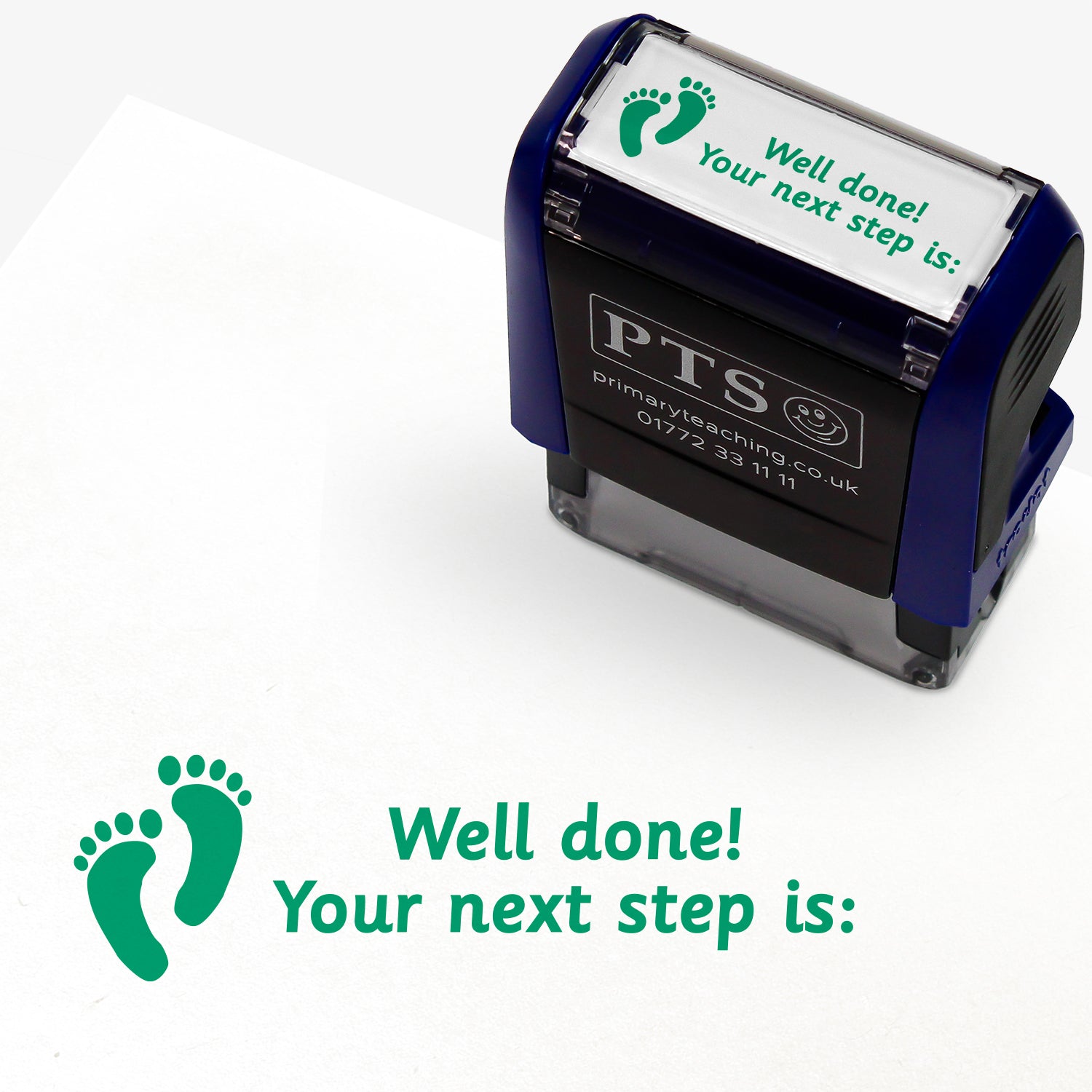 Rectangular self-inking stamper with green ink, displaying a green footprint icon alongside the text 'Well done! Your next step is:'; designed for marking and providing feedback in pupils' reading records and homework diaries.