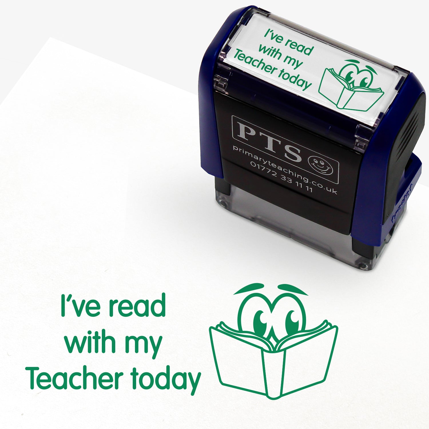 Rectangular self-inking stamper measuring 38mm by 15mm, featuring the phrase 'I've read with my Teacher today' in green text above an illustration of a smiling open book with eyes; designed for marking pupils' reading records and homework diaries.