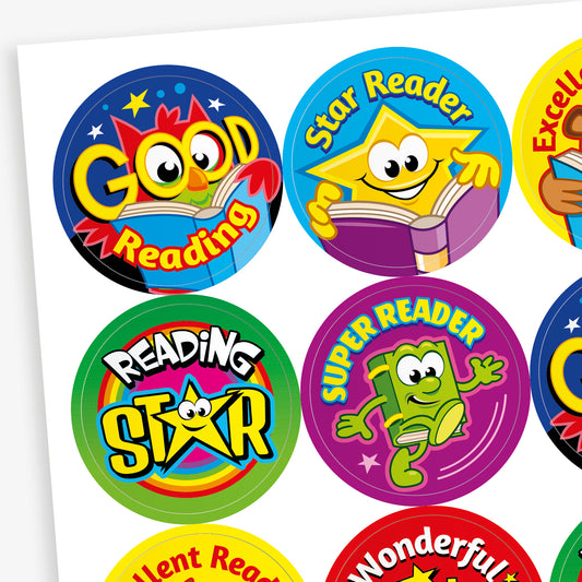A sheet of 32mm round reading reward stickers featuring vibrant designs with cartoon book characters and phrases such as 'Good Reading', 'Star Reader', 'Excellent Reading', and 'Wonderful Reading'. Each sticker showcases a unique colour scheme and cheerful illustration to encourage young readers
