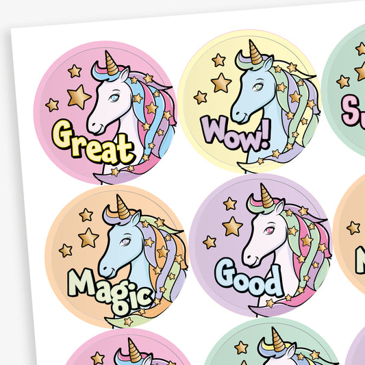 Sheet of 20 round pastel-coloured stickers, each 32mm in diameter, featuring a white unicorn with a rainbow mane and horn, surrounded by stars. Each sticker displays one of five motivational words: 'Great', 'Magic', 'Super', 'Wow!', or 'Good'.

