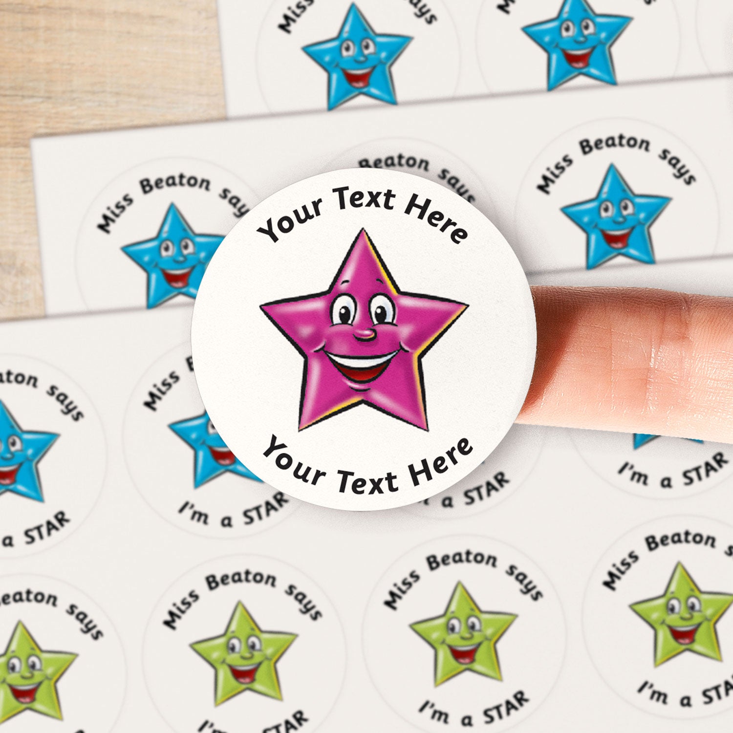 A close up image of a 3D purple smiling star on a sticker.  Text around the star is customisable
