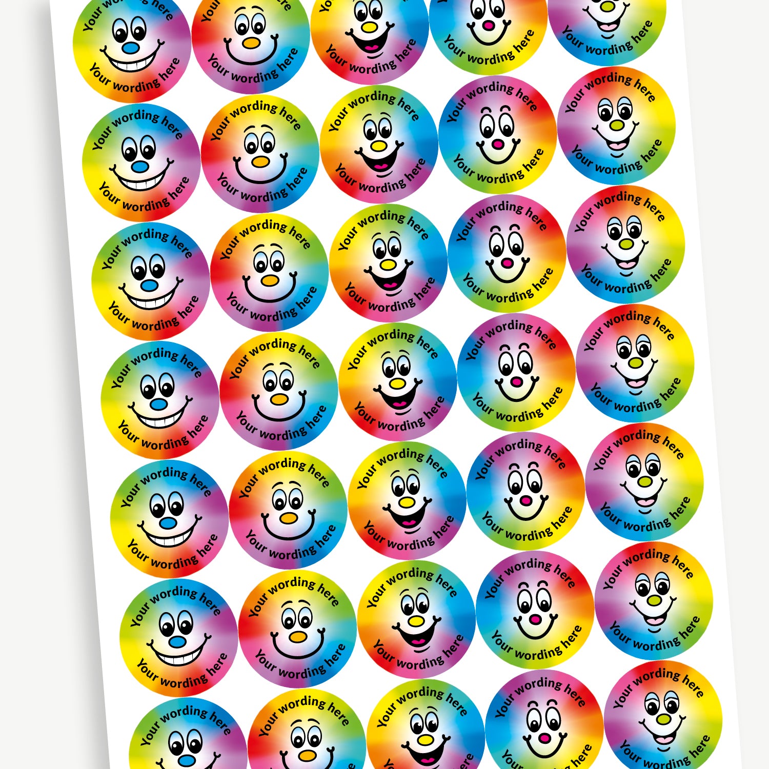 A sheet of 37mm round personalised stickers with sweet shop scent. The rainbow spectrum coloured stickers display various cartoon like smiling faces. Text around the character is customisable.
