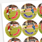A sheet of 32mm circular stickers with bubblegum scent.  Featuring goals being scored on a football pitch with phrases including 'Well done', 'Great', 'Superstar' and 'Amazing'. 
