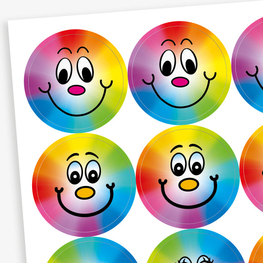 A sheet of 32mm circular stickers with berry scent.  Featuring a smiling face on a rainbow spectrum background. 
