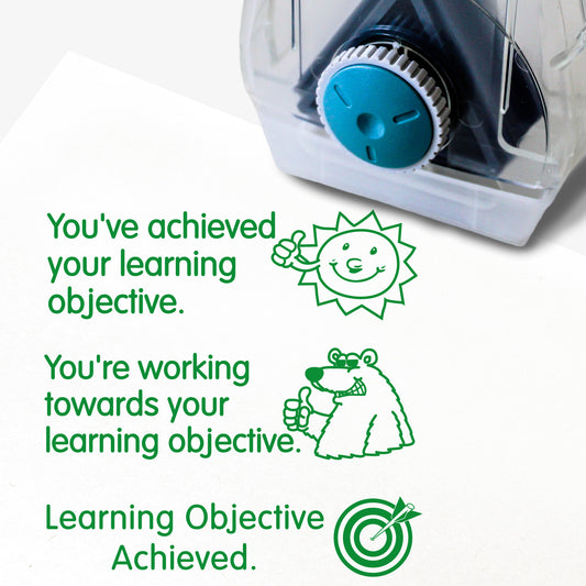 Complete Twist N Stamp.  Brick 1 Green ink -very happy face with phrase 'You've achieved your learning objective'.  Brick 2 green ink with smiling polar bear and phrase 'You're working towards your learning objective'  Brick 3 in green ink with unsure face and phrase 'You've not yet achieved your learning objective'.